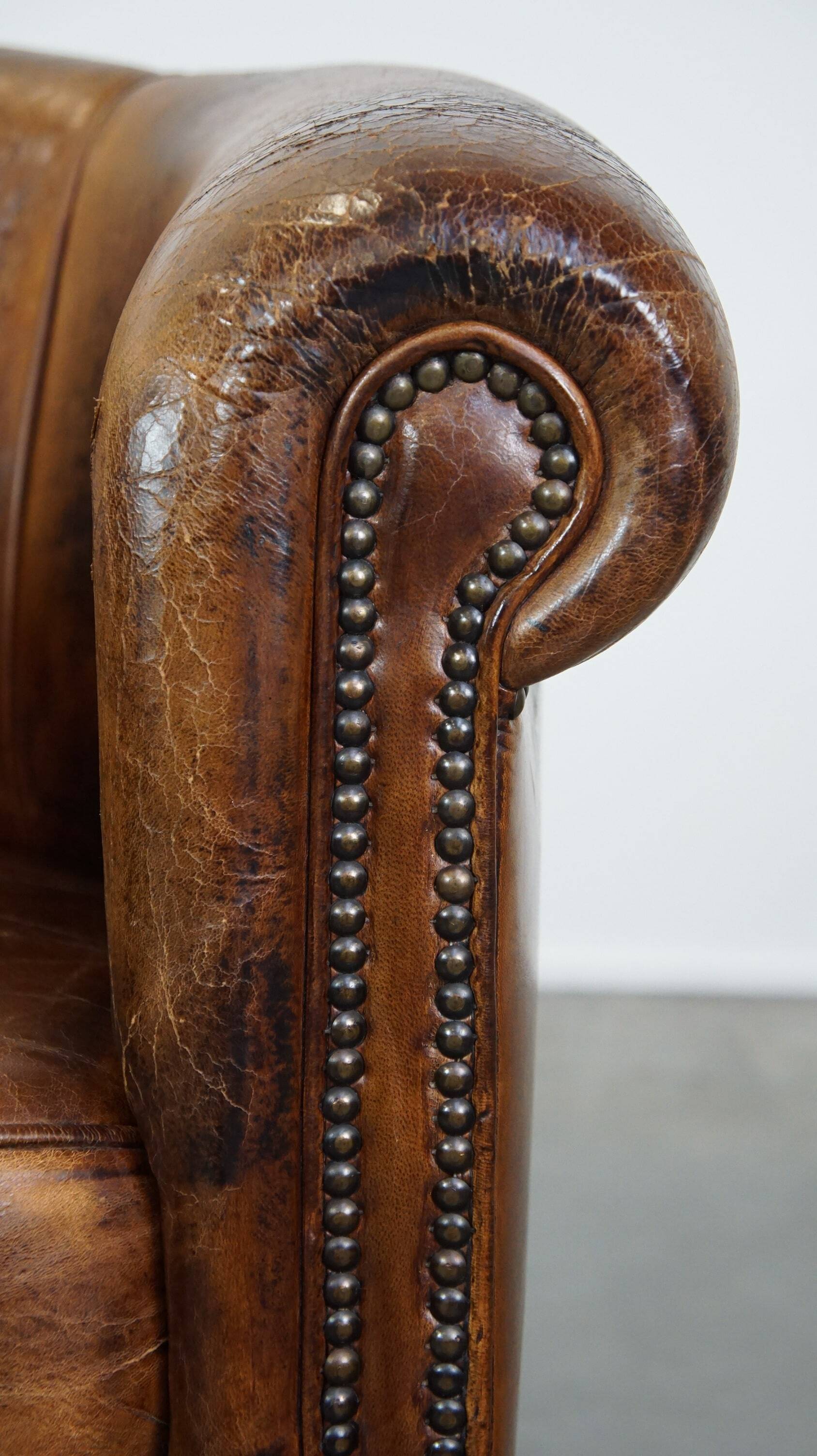 Sturdy, stately and subtle vintage sheepskin club chair