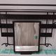 Art Deco wrought iron coat rack with bevelled mirror.