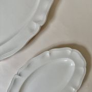 Shaped plates and dishes in Sarreguemines earthenware.