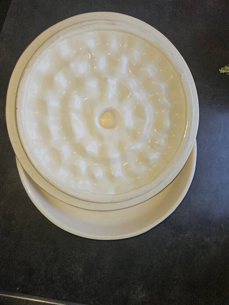 Glazed ceramic dessert plate with strawberry design.