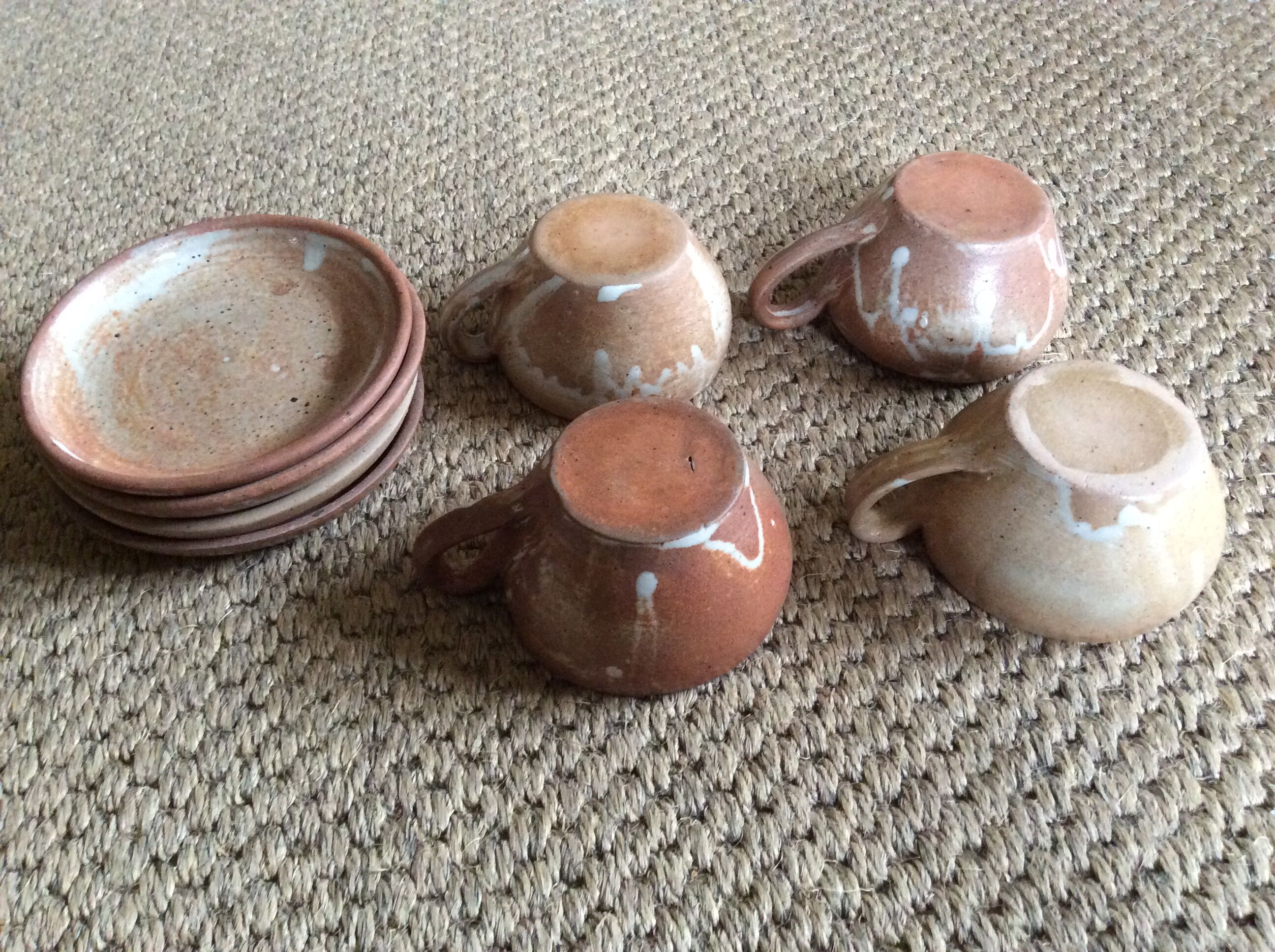 Series of 4 stoneware coffee cups