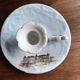 Antique handheld candle holder in porcelain