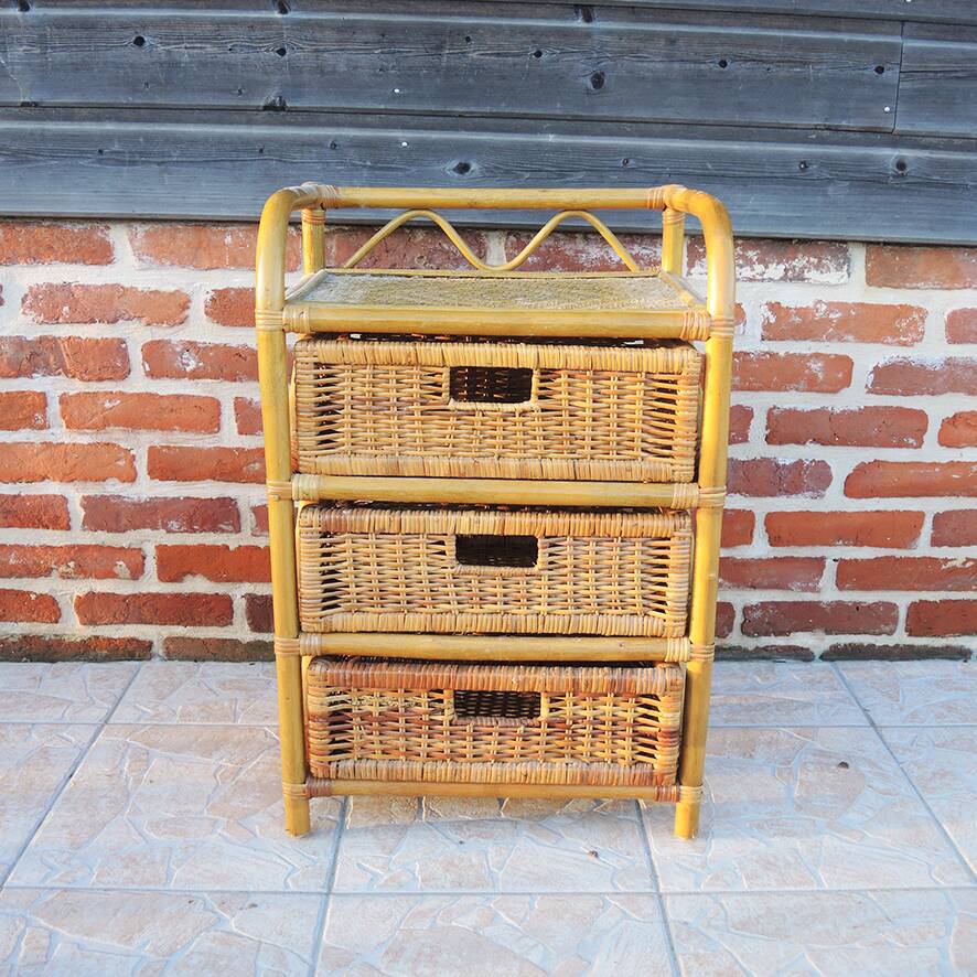 Old chest of drawers with 3 bamboo and wicker drawers.