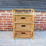 Old chest of drawers with 3 bamboo and wicker drawers.