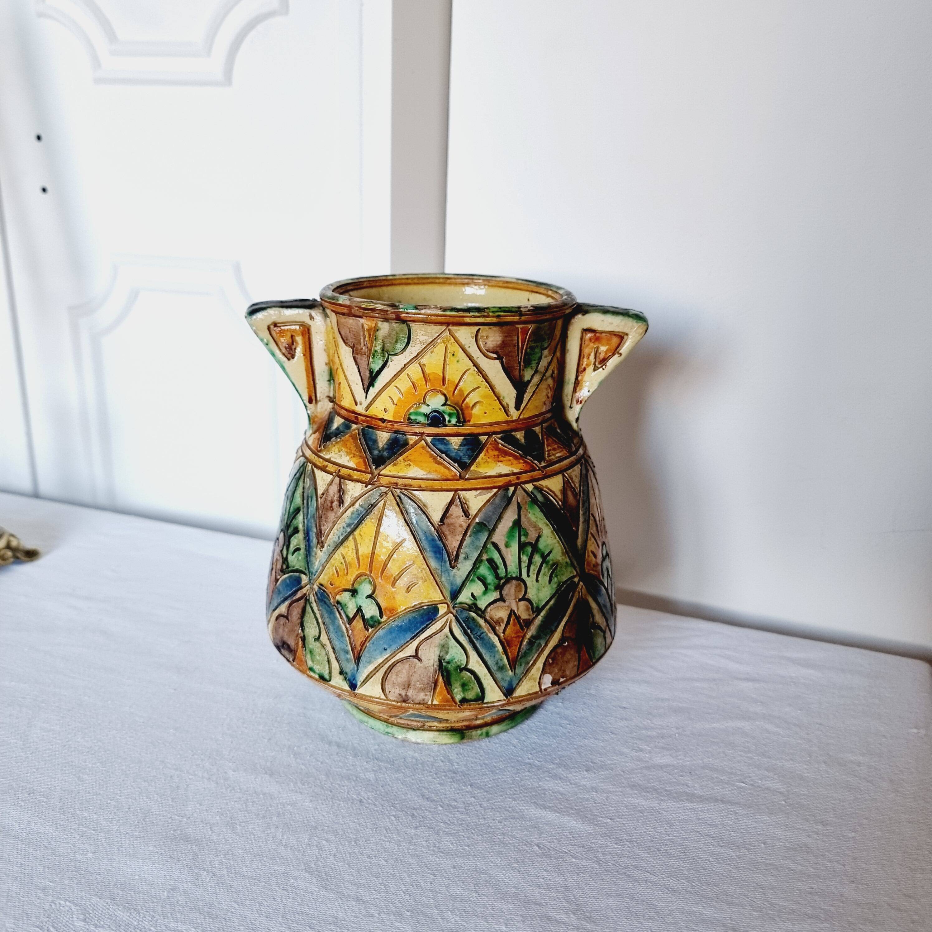 Antique majolica water pitcher made in Italy and hand painted.