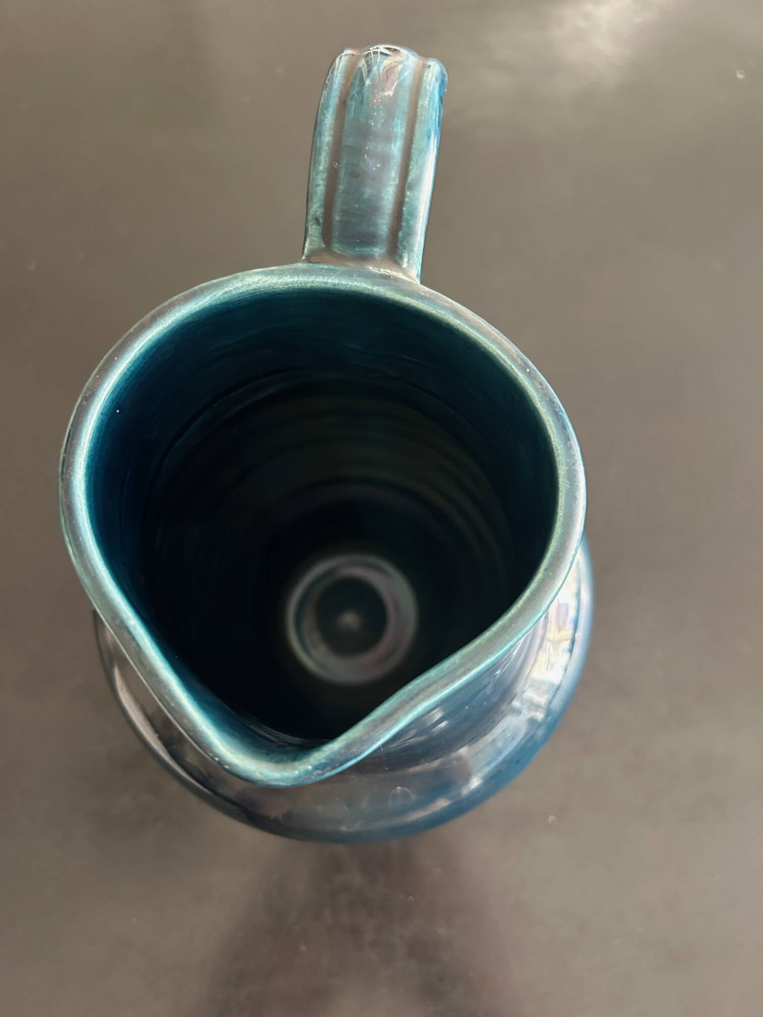 blue pitcher the potter chin