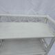 White rattan wall shelf