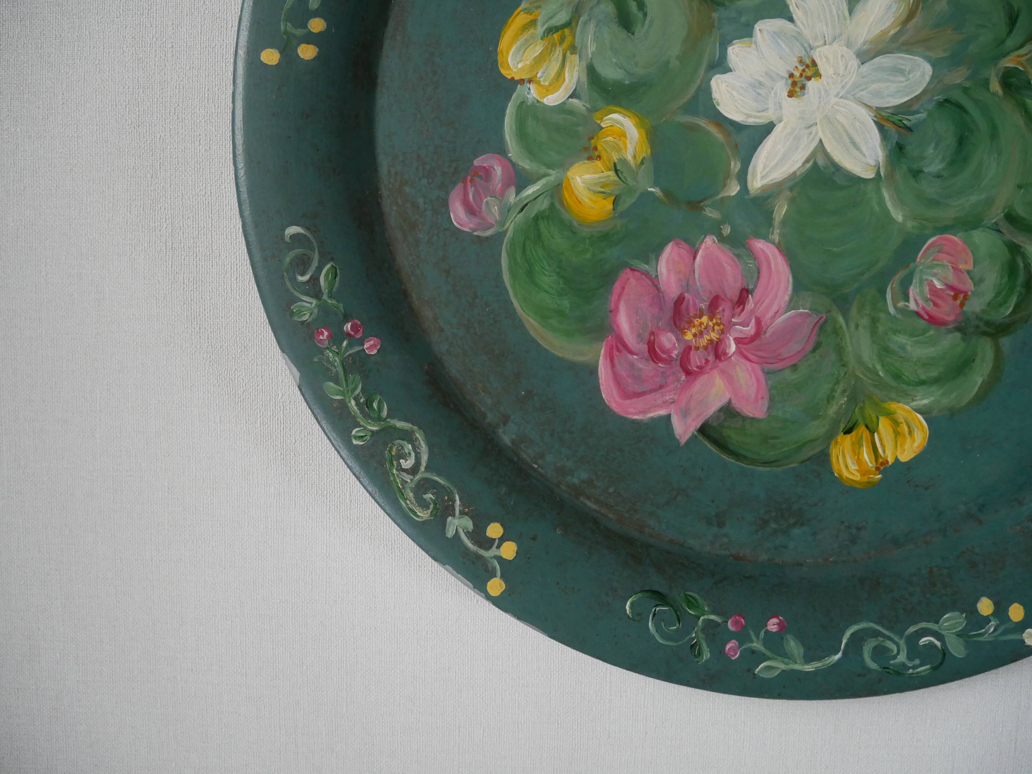 Metal serving tray with hand-painted floral decoration in a country flea market style