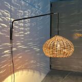 Mid-century modern Danish extendable cantilever wall lamp with a rattan shade, 1960s.