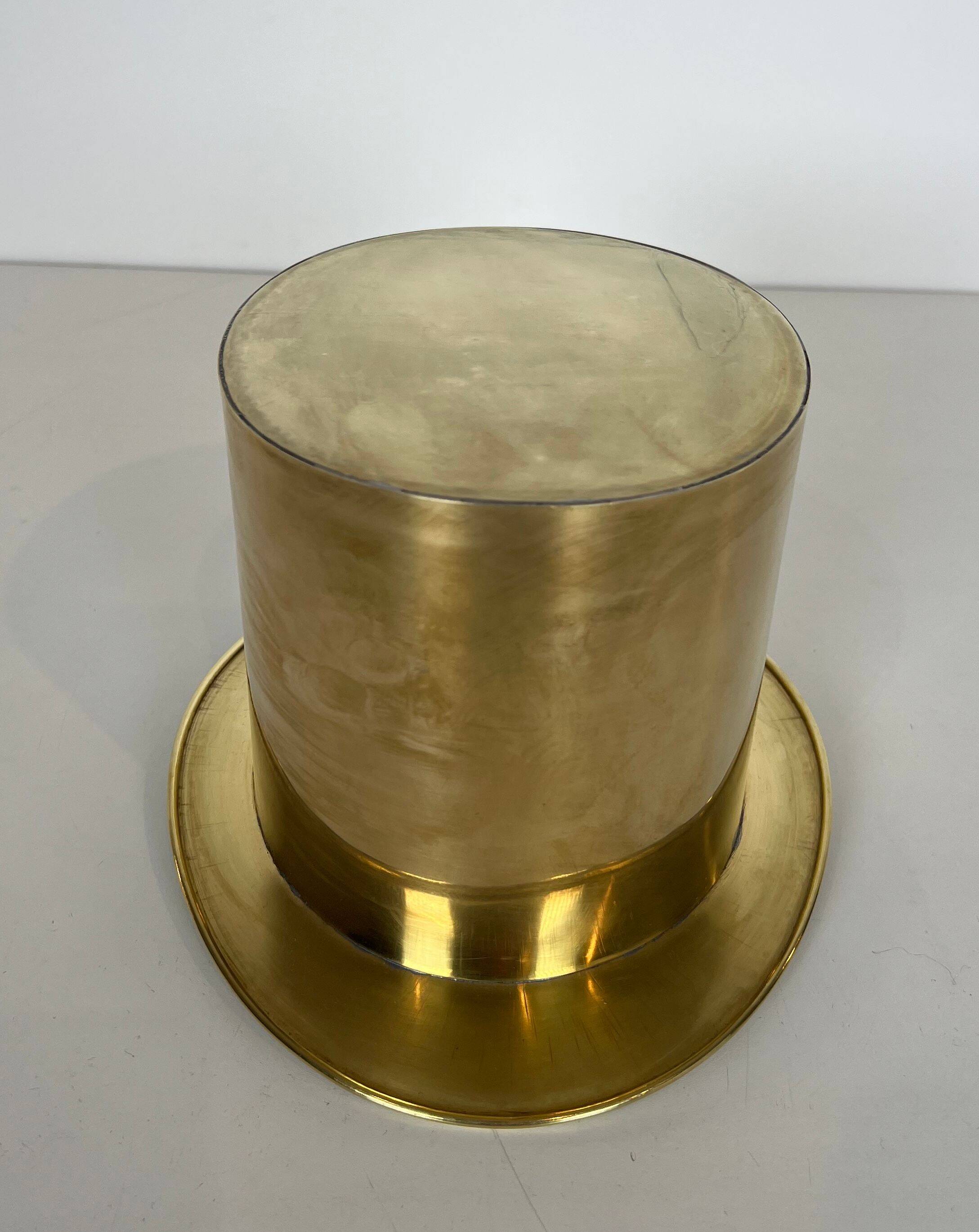 Champagne cooler shaped like a brass top hat.
