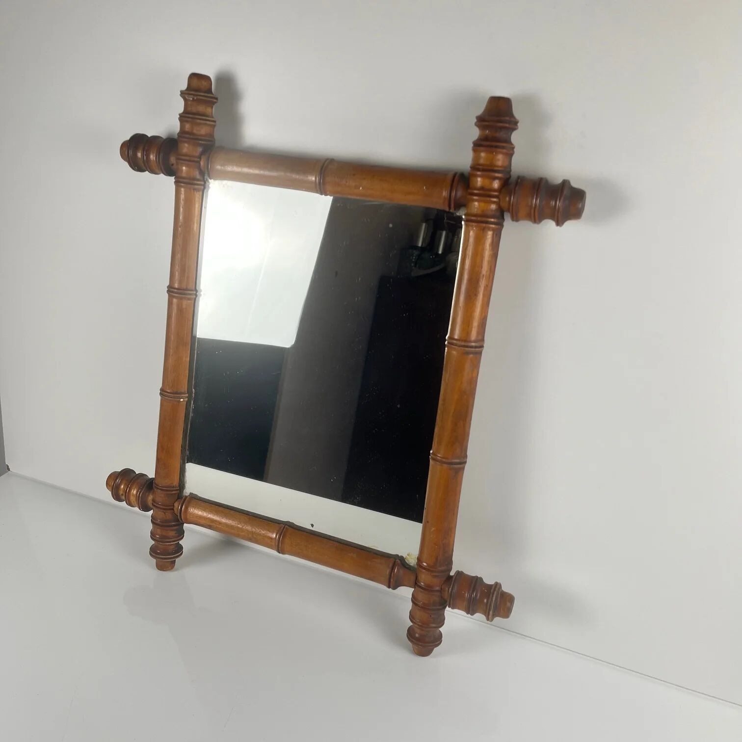 Wooden turned mirror in bamboo style, circa 1900-1930.