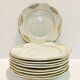 9 plates in white and gold porcelain