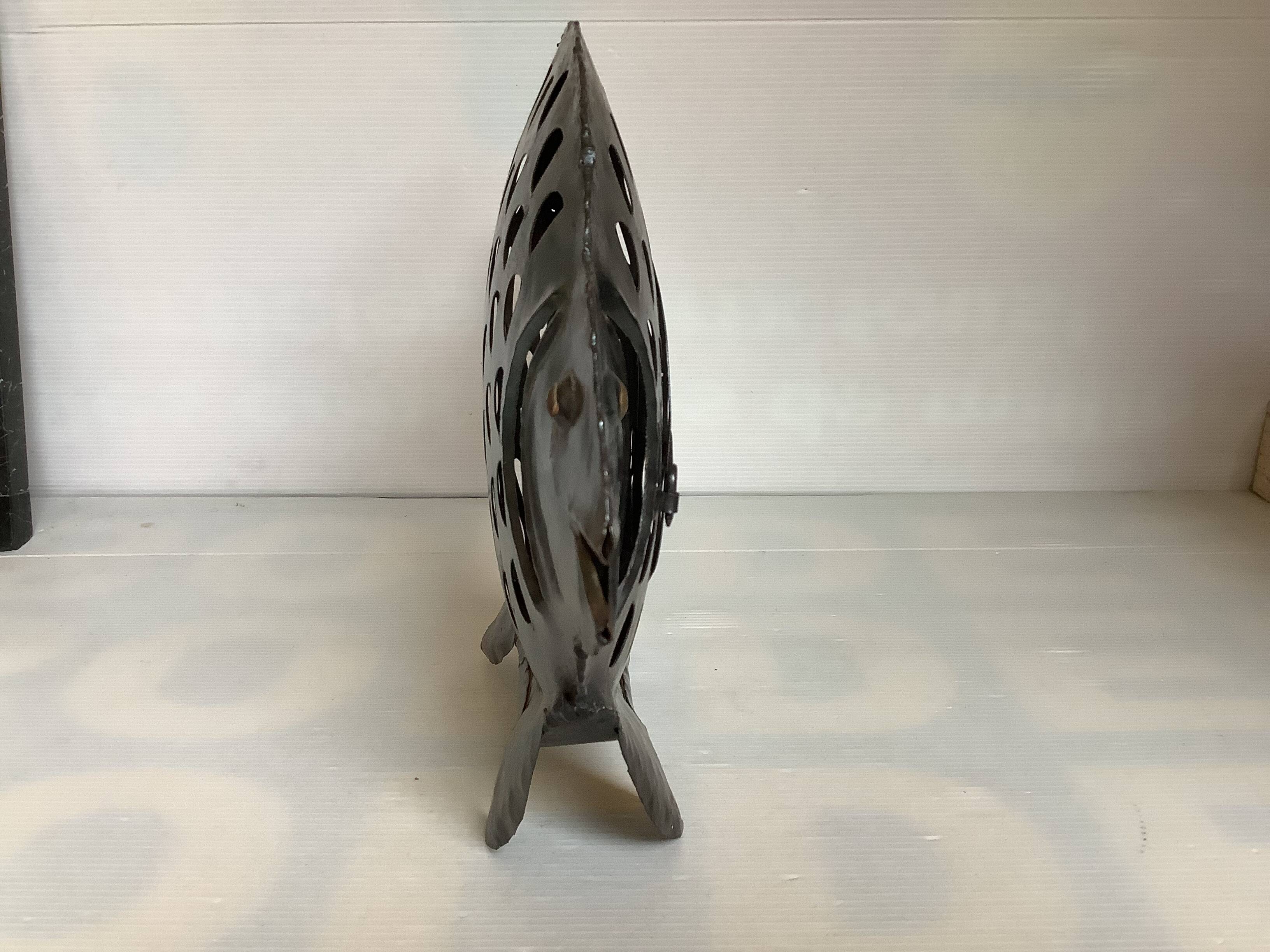 Large metal fish-shaped candle holder