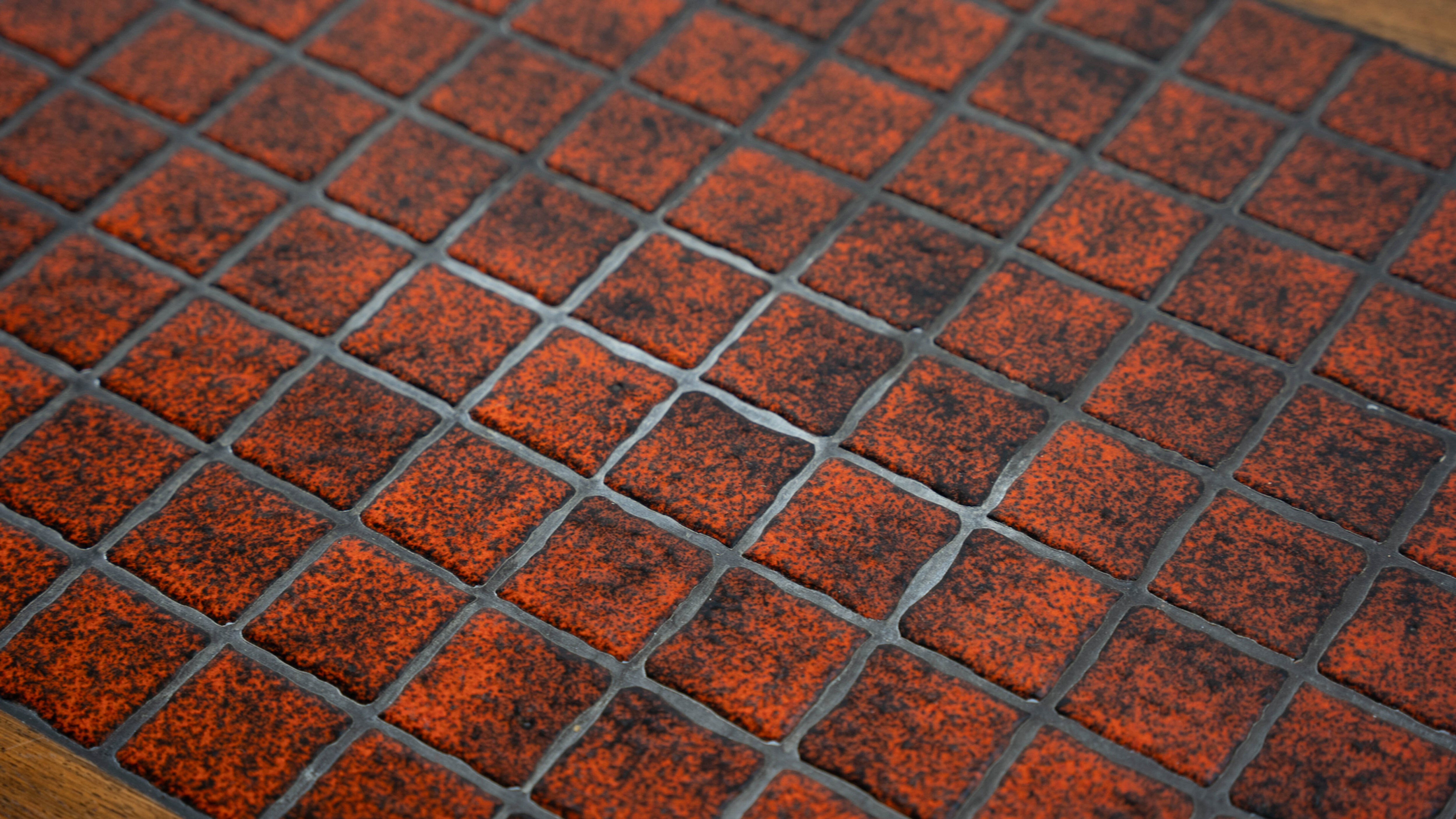 Danish red ceramic and teak coffee table