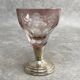 Set of 6 coloured stemmed glasses on silver stems.