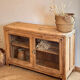 Old wooden buffet with a glass front in raw wood