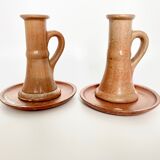 Pair of candlesticks and two sandstone cups