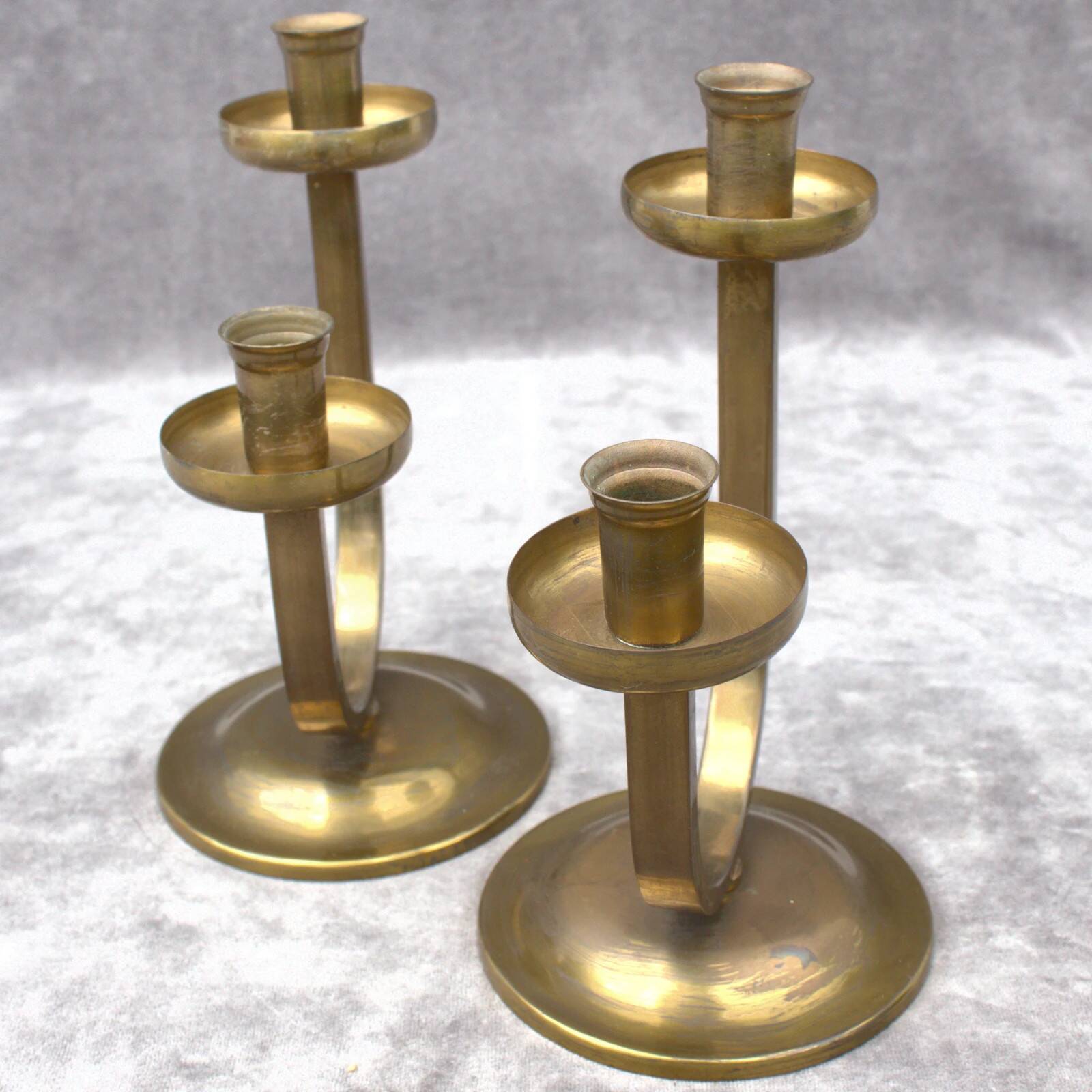A beautiful pair of antique French Art Deco brass candlesticks