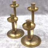 A beautiful pair of antique French Art Deco brass candlesticks