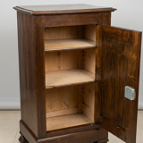 Small storage unit in solid wood and copper.