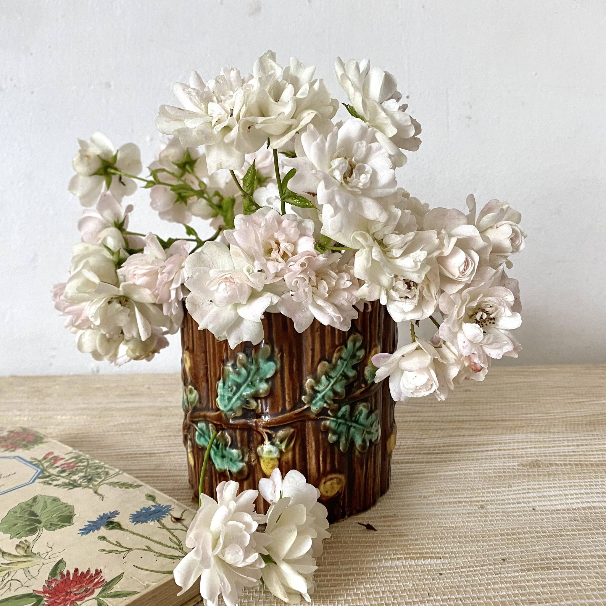 Antique slip pot with acorn decoration