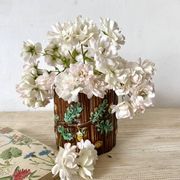 Antique slip pot with acorn decoration