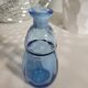Small blown blue glass bottle