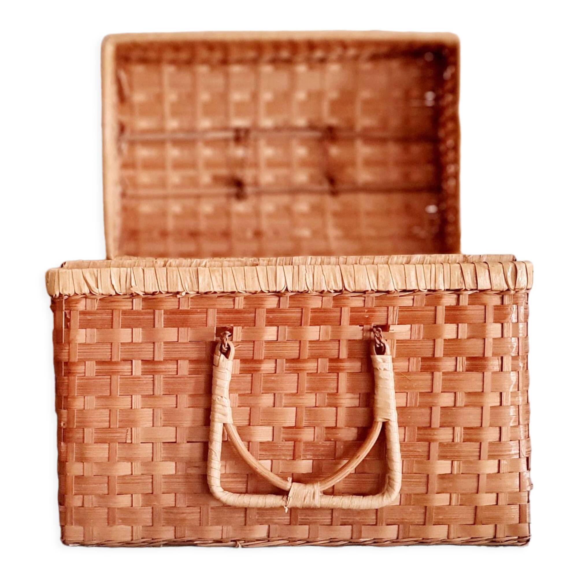 Small suitcase in vintage rattan trunk