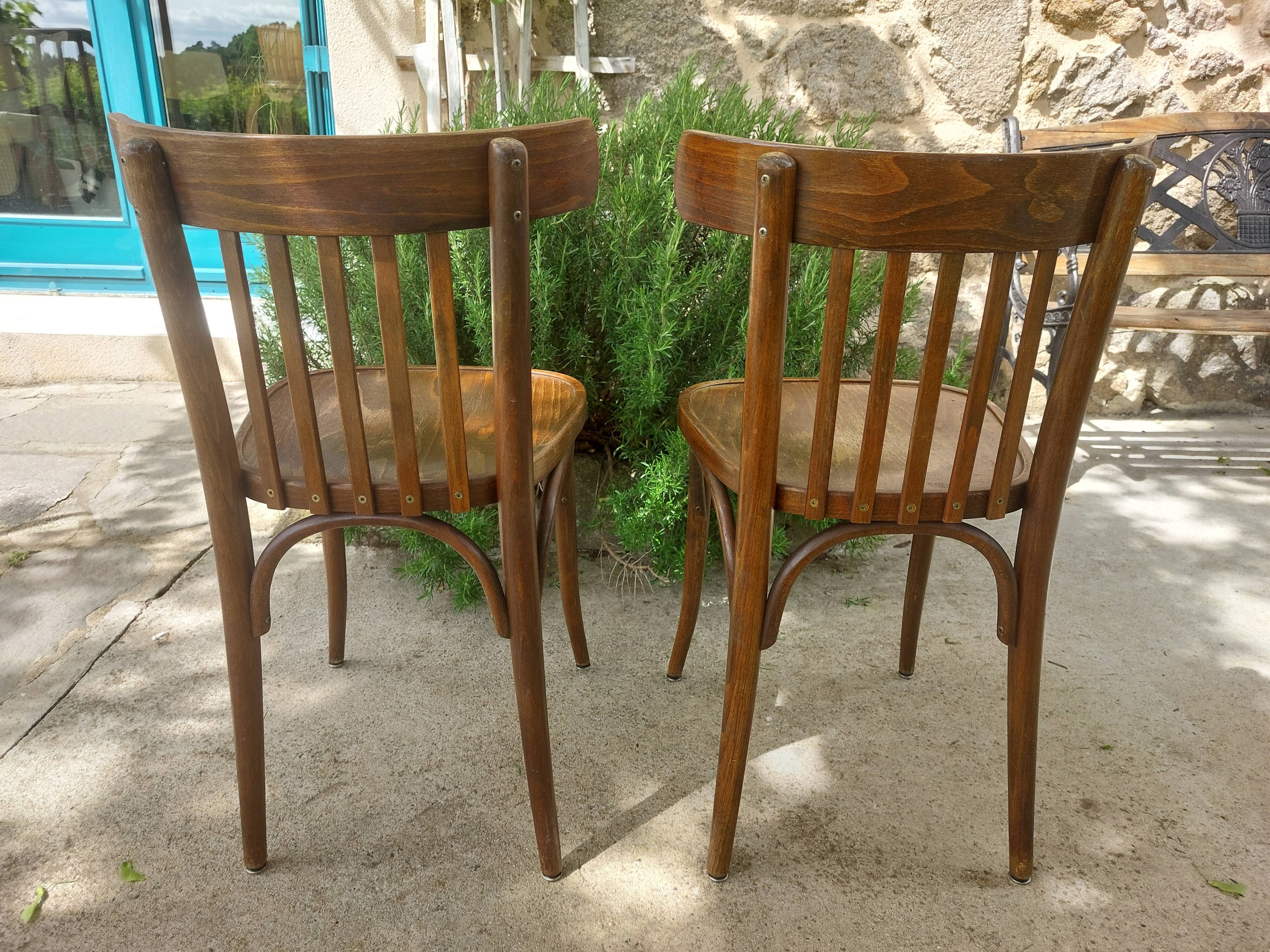 pair of dark bistro chairs, rounded backs, Baumann style