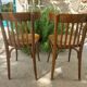 pair of dark bistro chairs, rounded backs, Baumann style