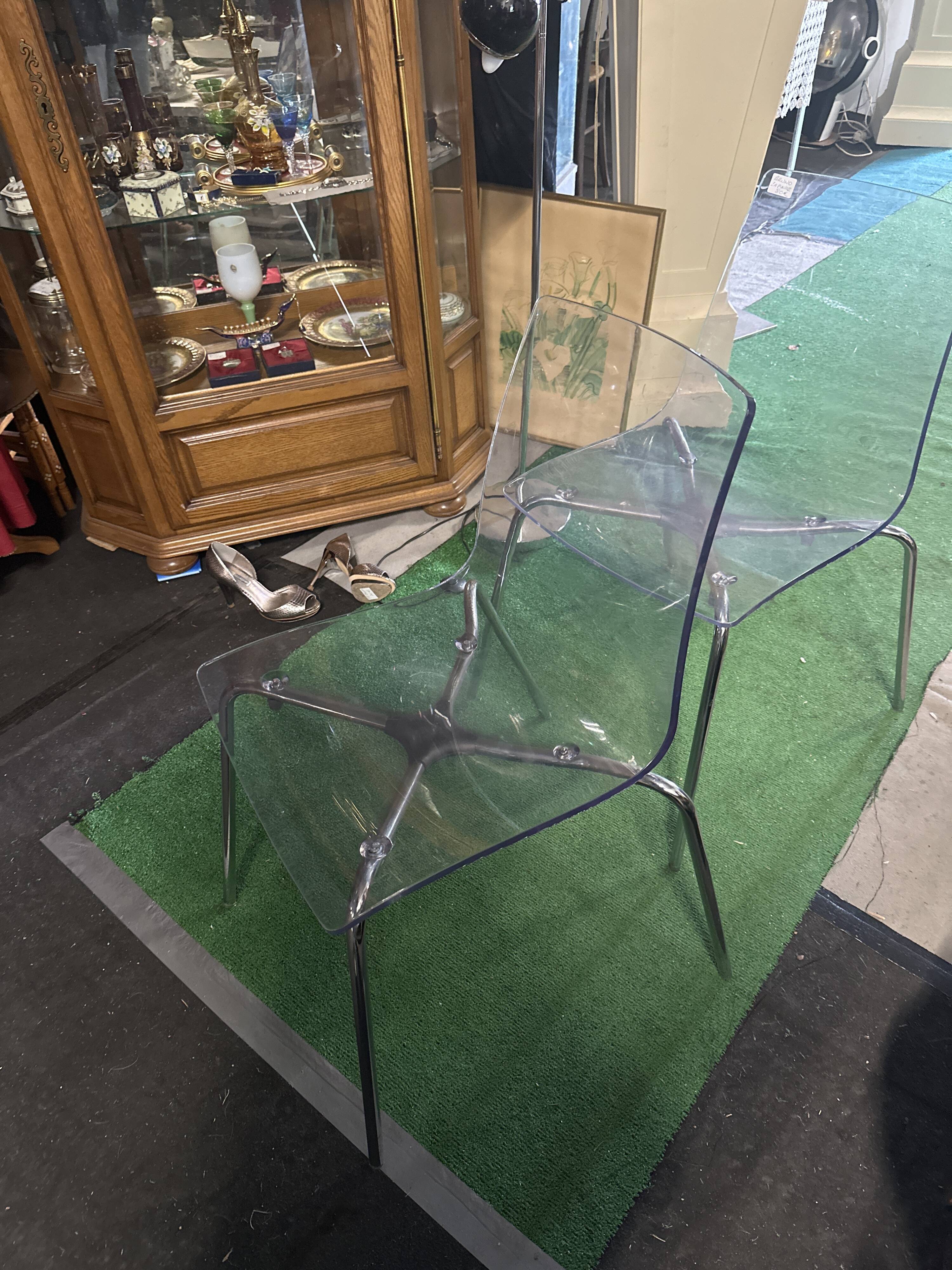 Pair of smoked polycarbonate chairs