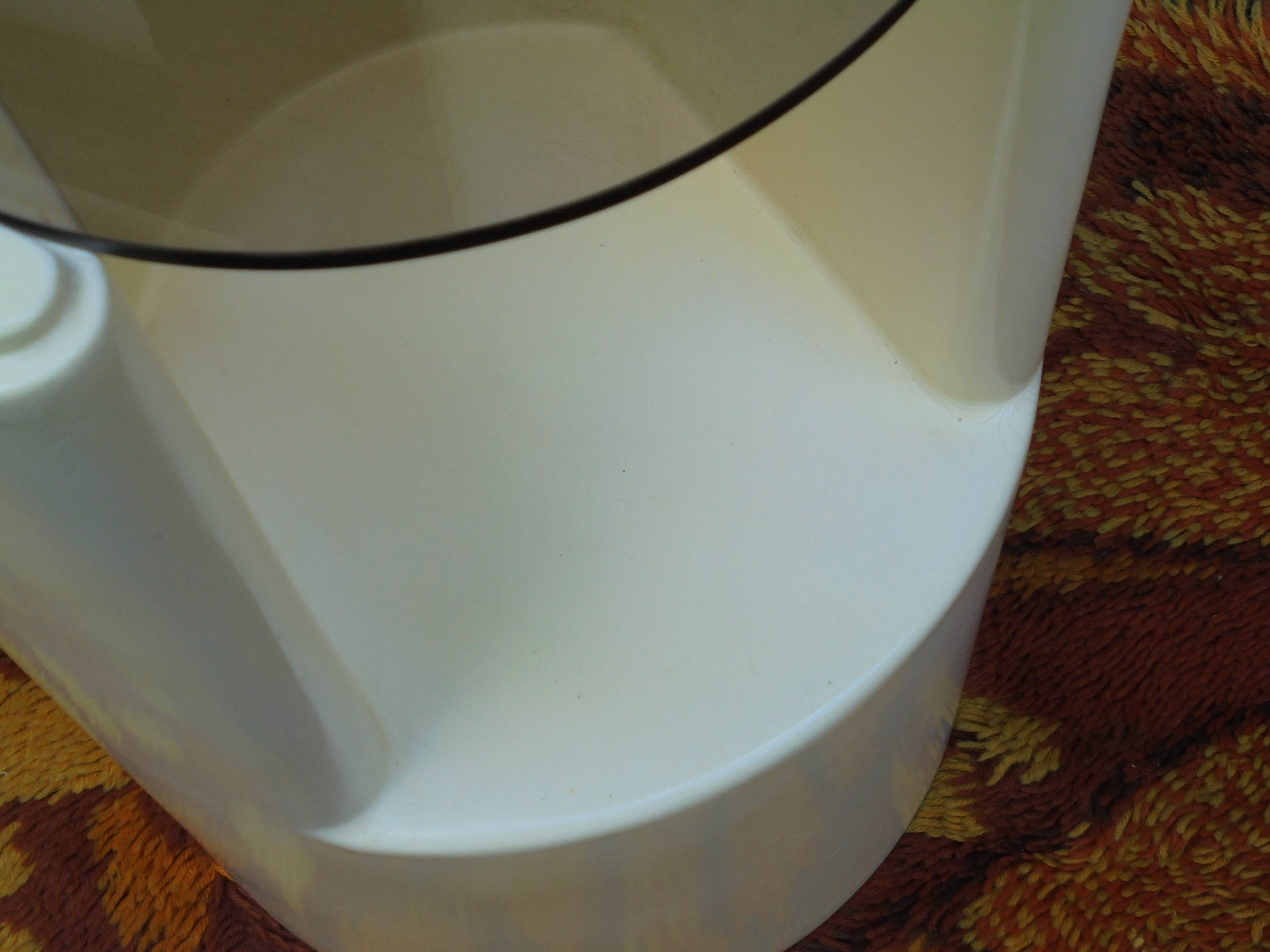 Cylindrical fiberglass bedside table from the 60s