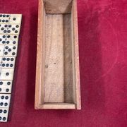 Set of complete dominoes made of bone, nails and blackened wood