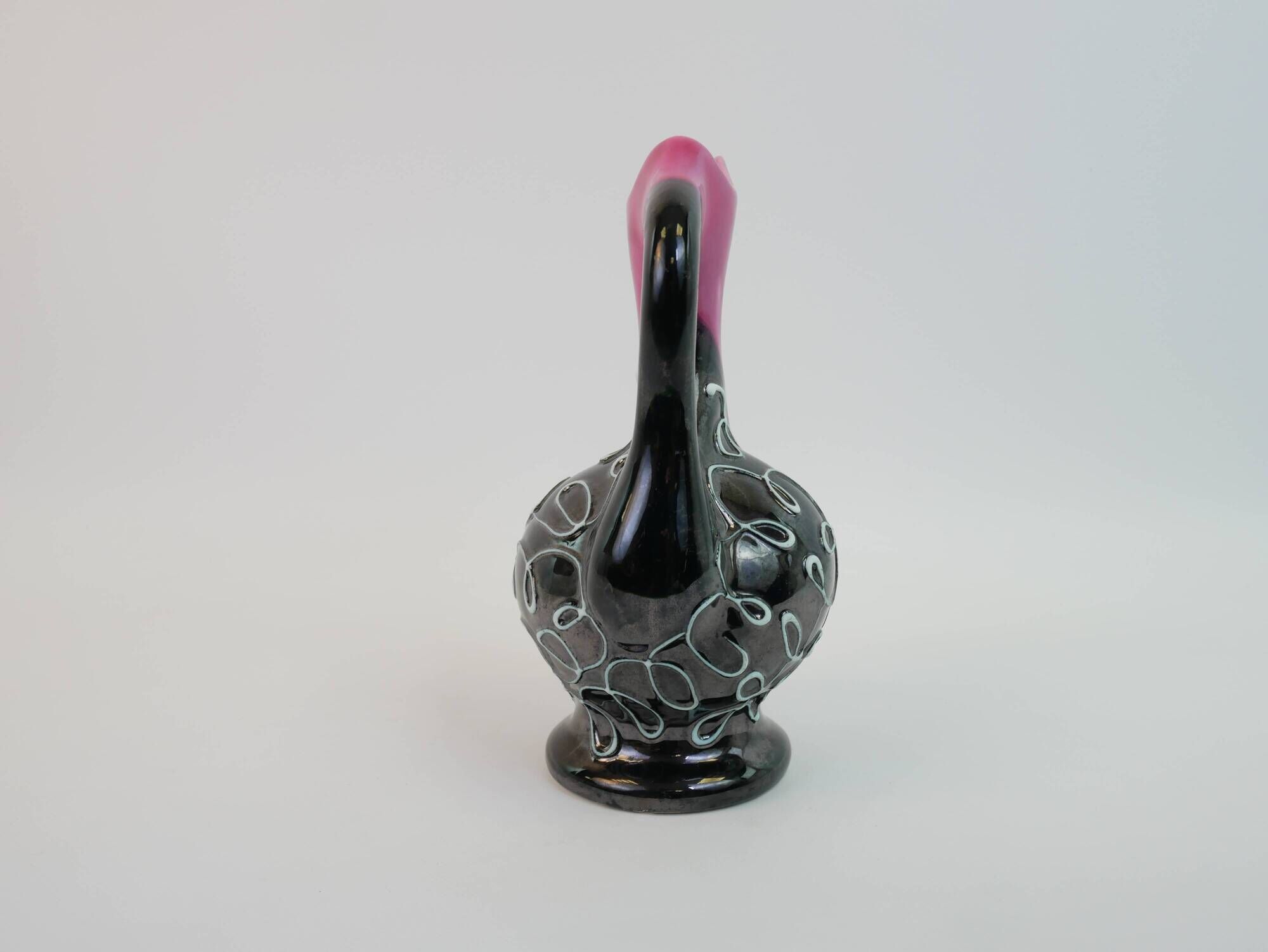 Black and pink Vallauris carafe with white relief patterns
