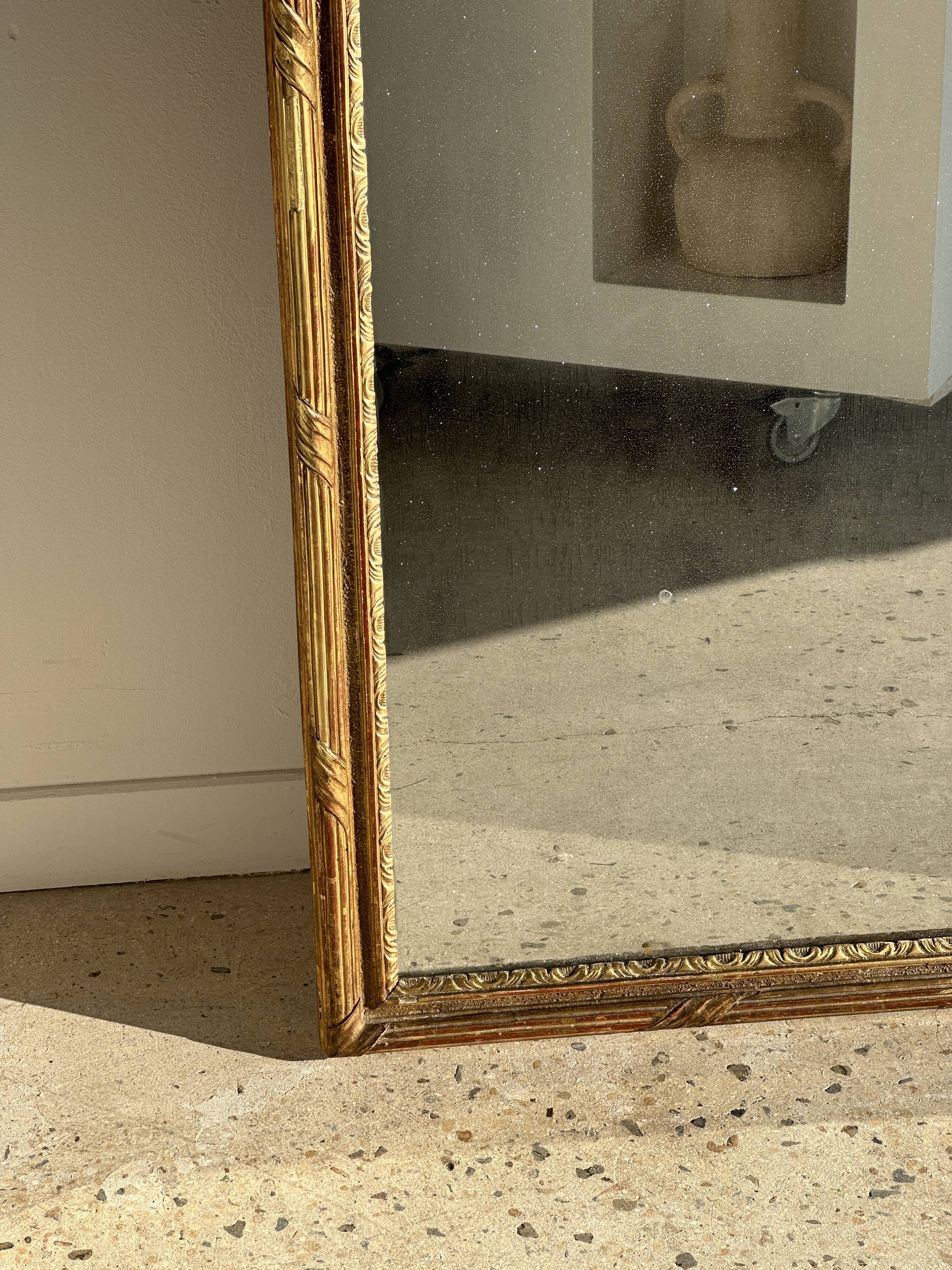 Large gilded mirror 19th century rounded corners mercury glass Louis XVI style