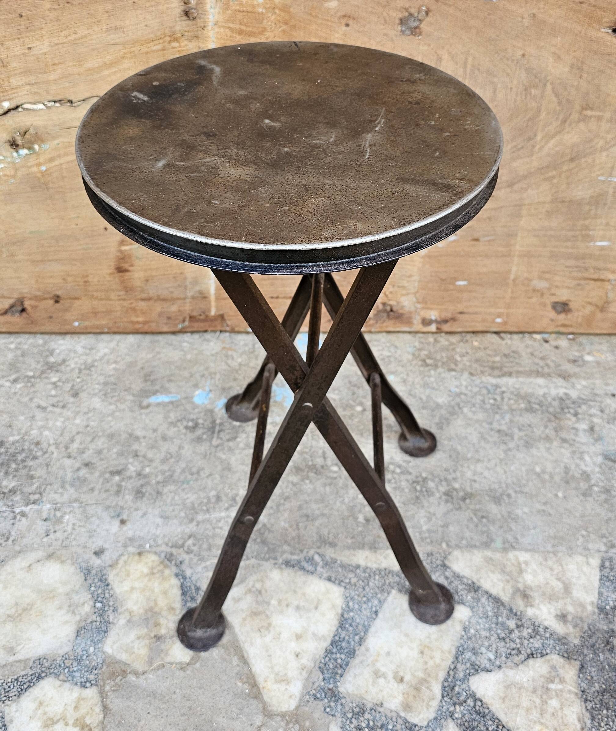 Old industrial folding steel stool