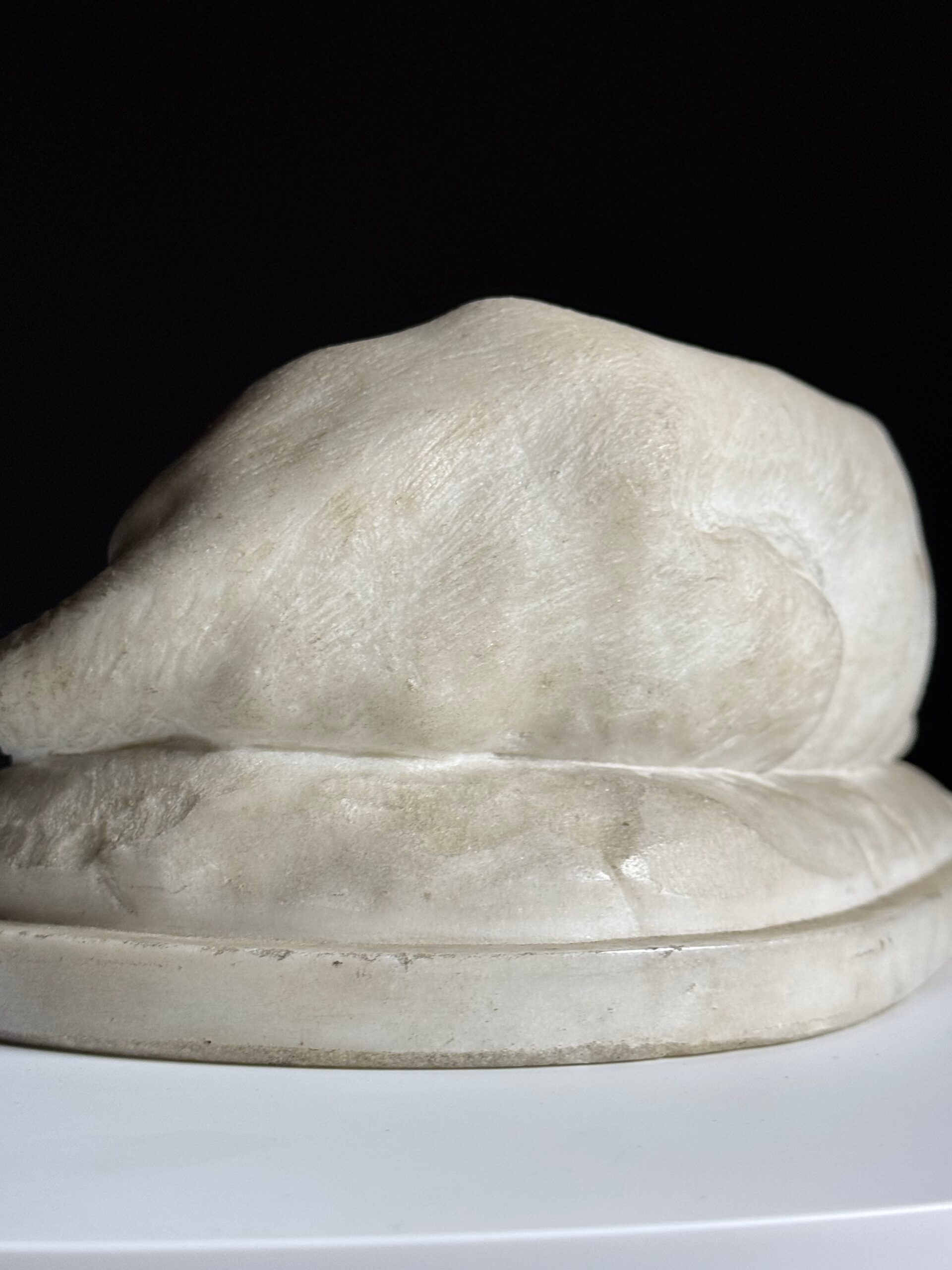 Marble sculpture of a reclining lion