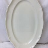 Old ivory-colored, oval-shaped dish with chamfered edge