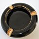 Black ceramic ashtray and vintage gold 50/60