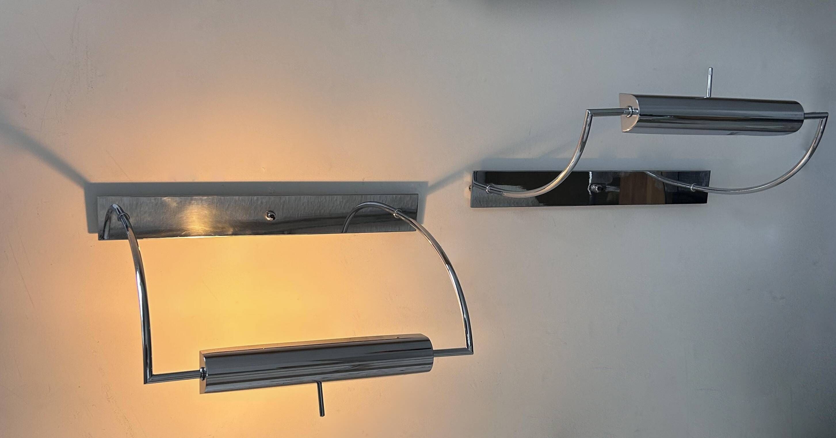 Pair of vintage adjustable wall lights, chrome metal, France 1970.