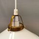 A set of hanging lamps in milky white opal glass with brass top.