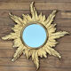 Miroir soleil en bois doré