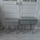 Duo of bedside tables, vintage mismatched verdigris end tables.