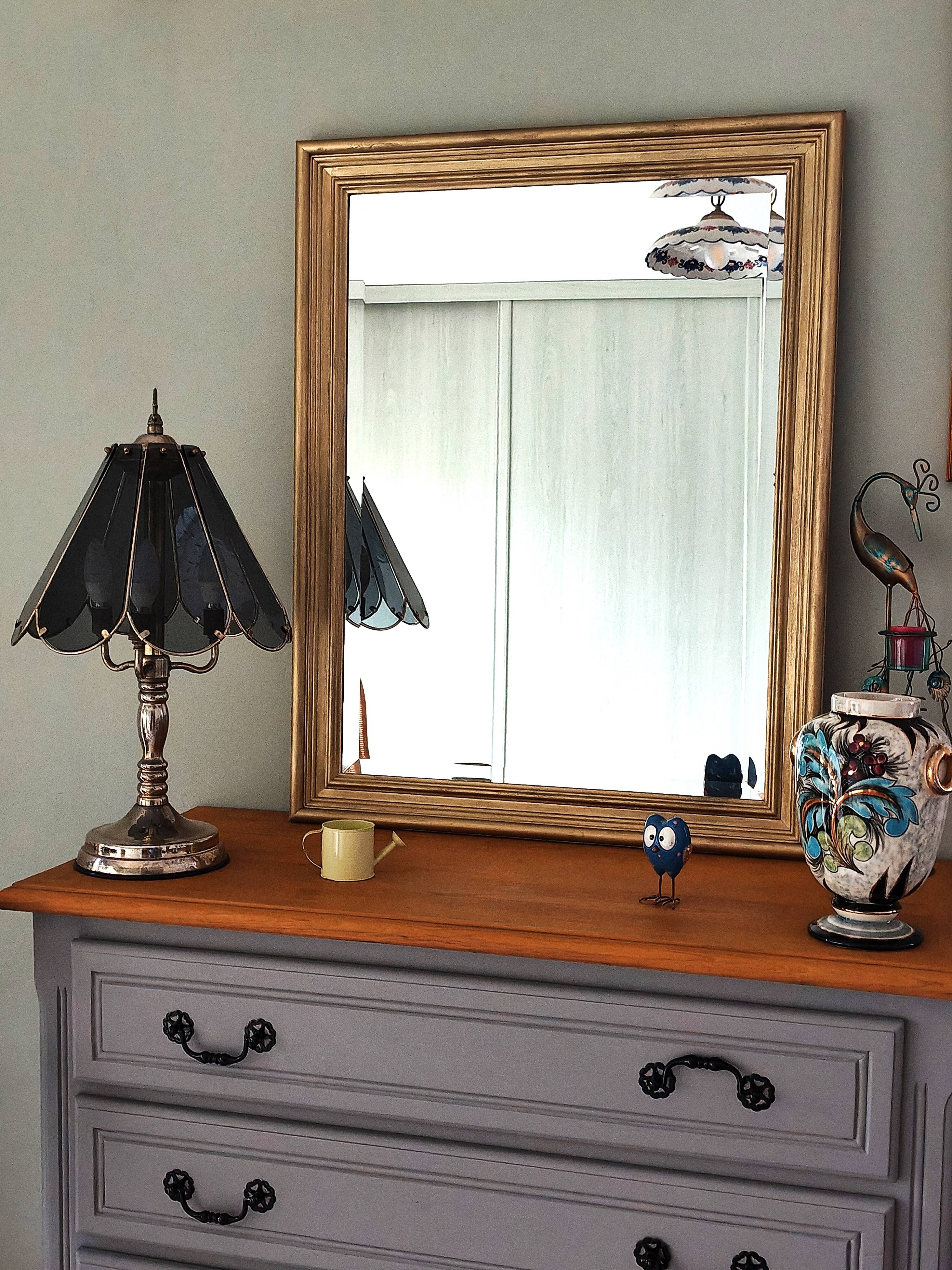 Large gold-framed mirror with bevelled glass.