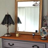 Large gold-framed mirror with bevelled glass.