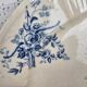 Old Gien plate with carved edges featuring doves and blue flowers, circa 1920-1930.