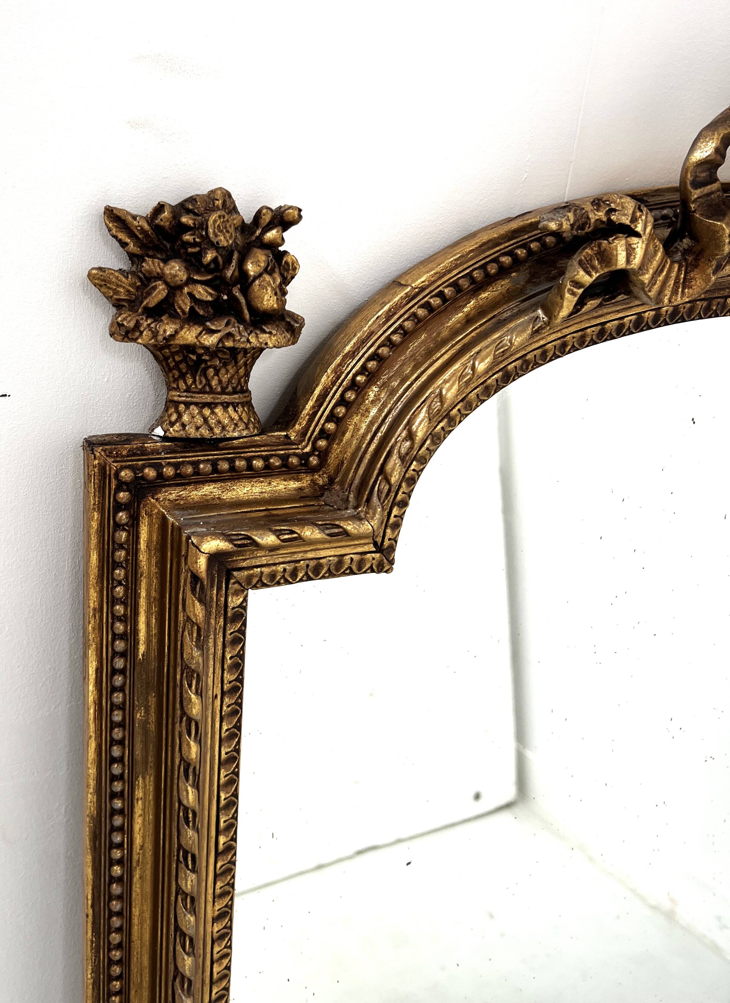 Louis XVI style mirror in wood and gilded stucco, 19th century