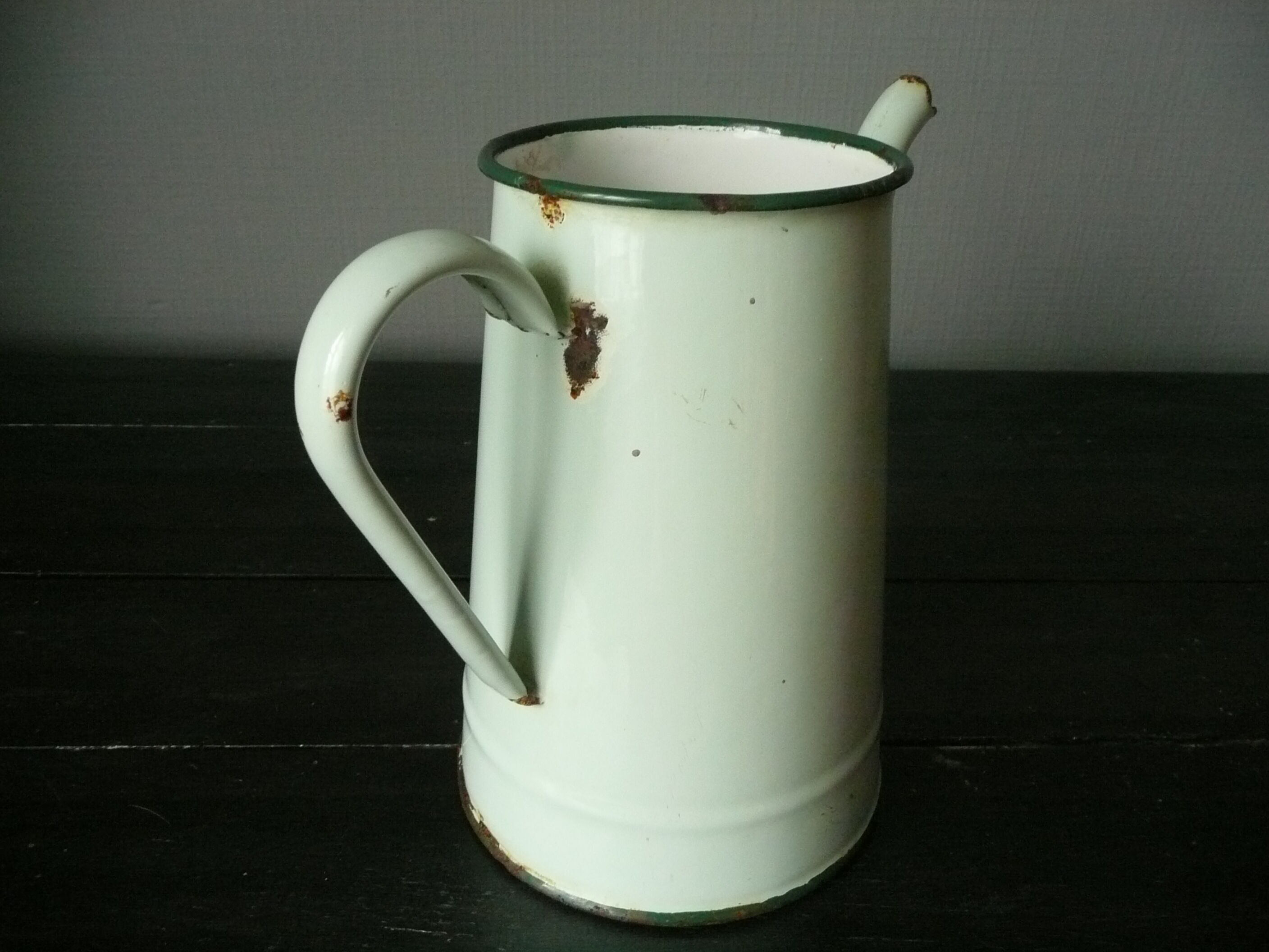Antique enamelled pitcher