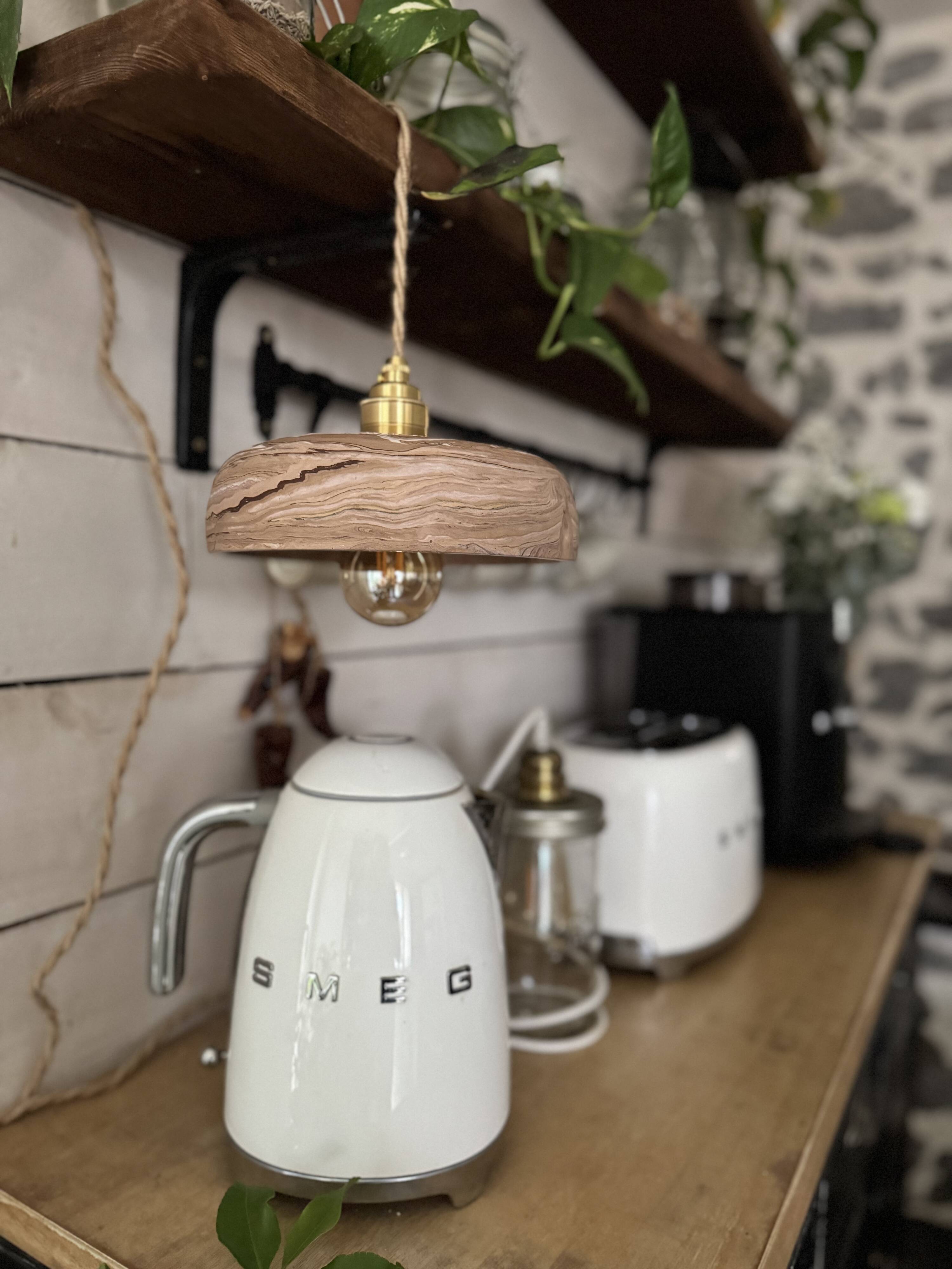 Handcrafted portable lamp with a marbled stone effect