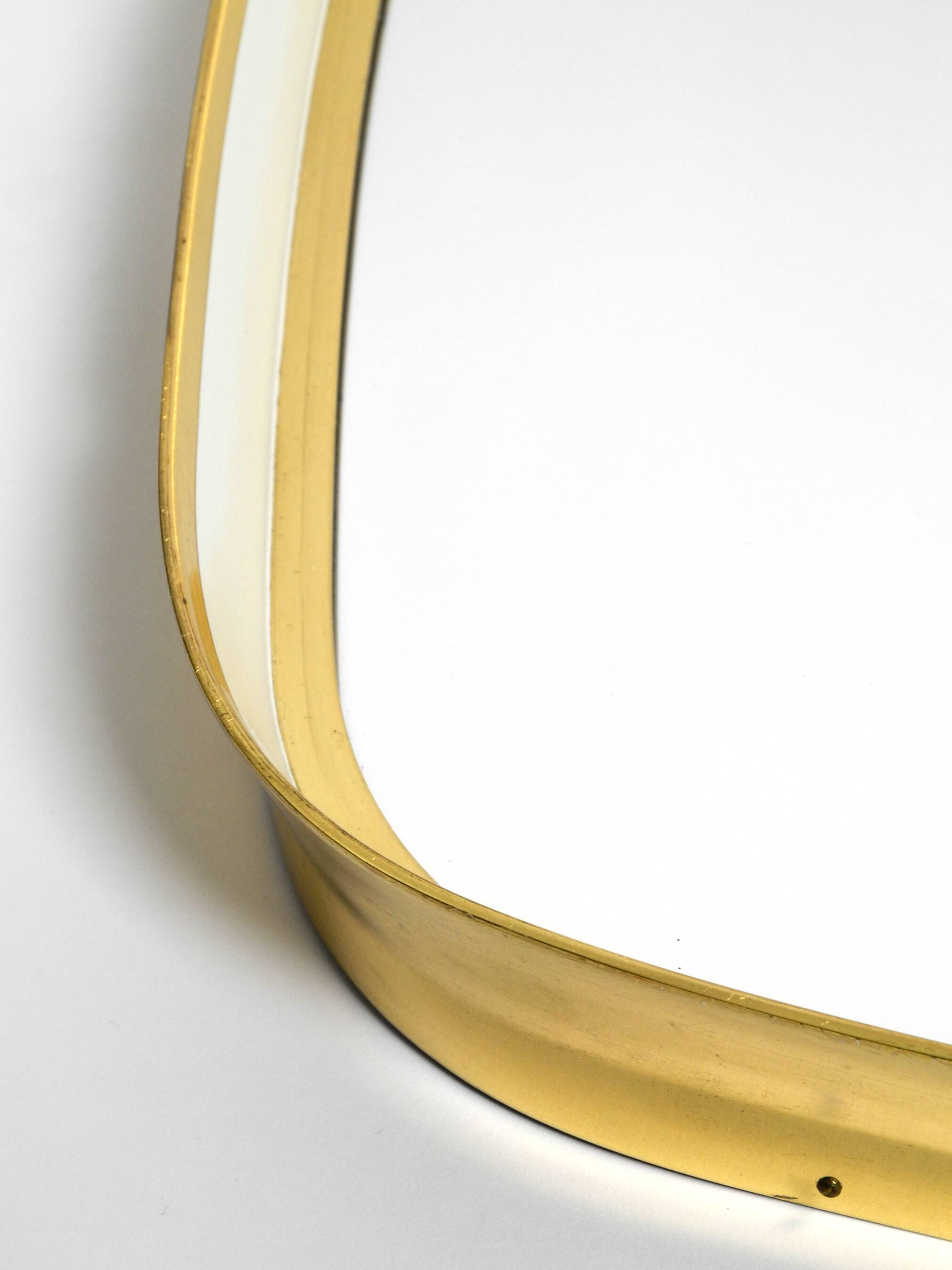 Huge Mid Century "Zier-Form" wall mirror with heavy brass frame with Label
